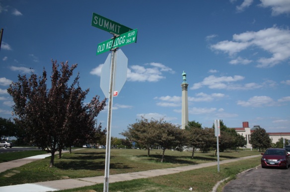 Seemingly sprouting from the grass and trees is a Civil War Memorial. The triangular Summit Park is surrounded by John Ireland Boulevard on the west, Summit on the east and Kellogg Boulevard to the north.