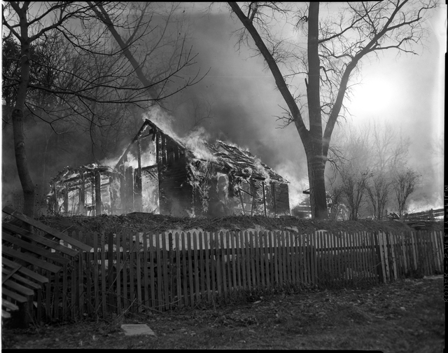 After all the residents of Swede Hollow were gone, the City of Saint Paul burned down the remaining structures. December 1956. Courtesy of the Minnesota Historical Society.
