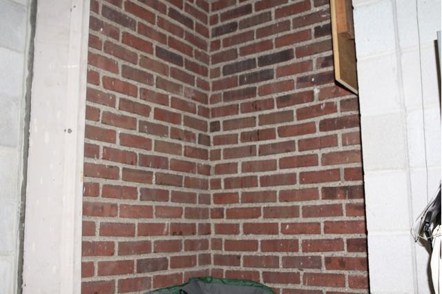 This was once an exterior corner of Central High. The light color cement on bordering the brick on the left is part of an exterior window frame.