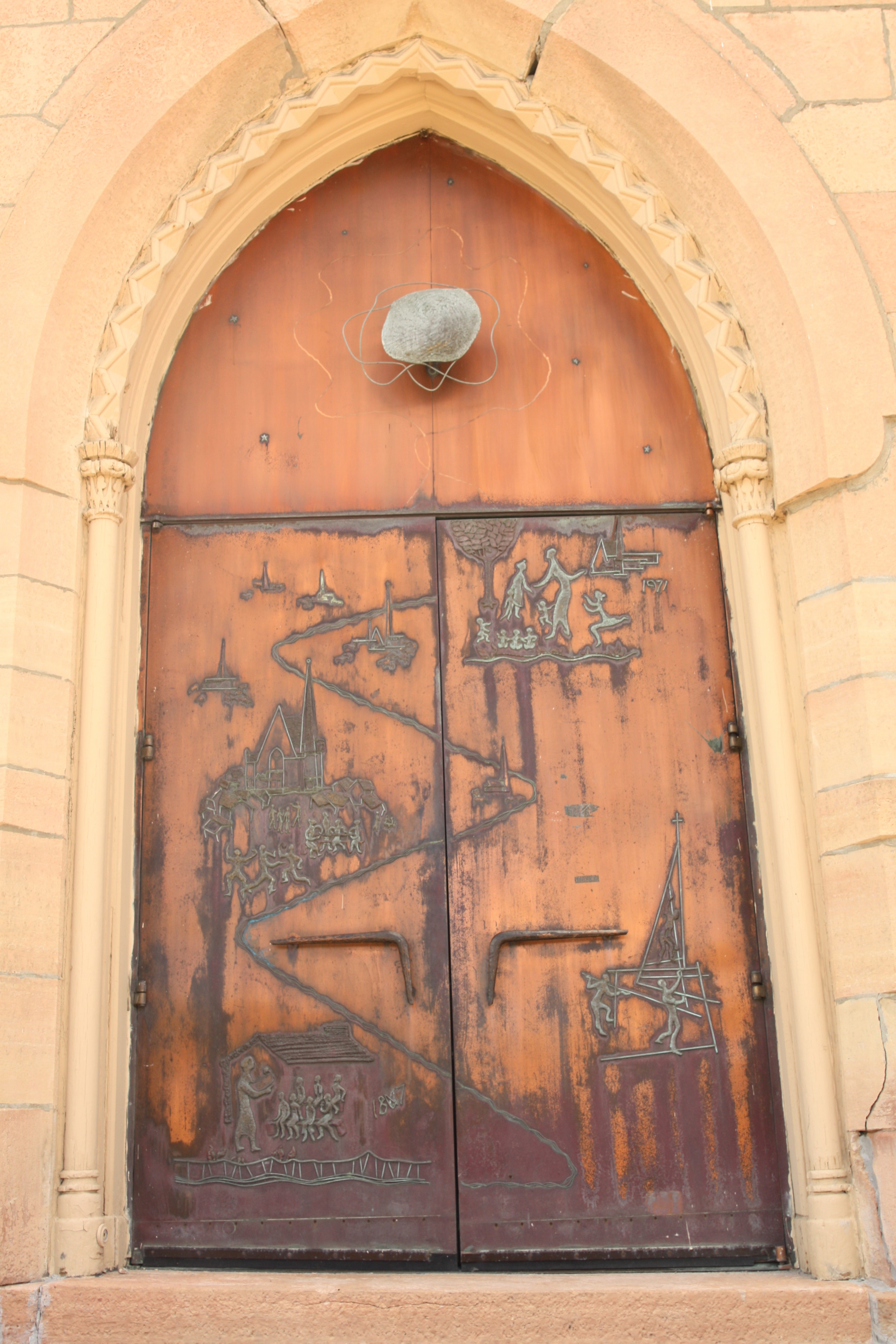 Copper doors, etched with scenes from First Baptist’s history, were added in 1971.